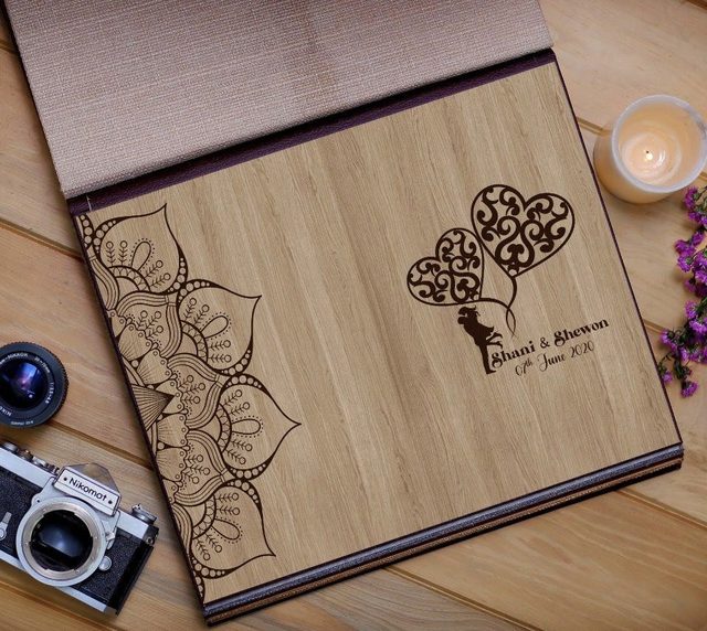 Engraved wooden cover album