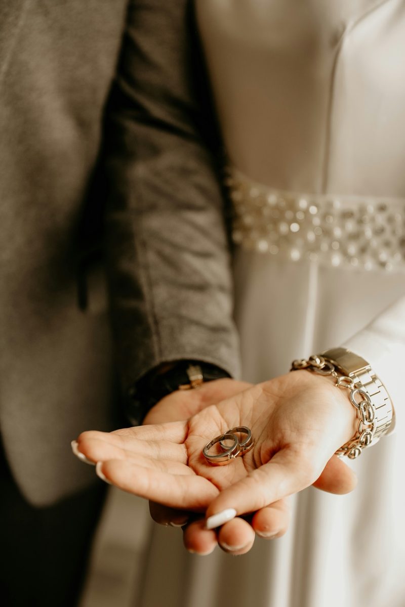 Wedding rings resting in the palm of a hand