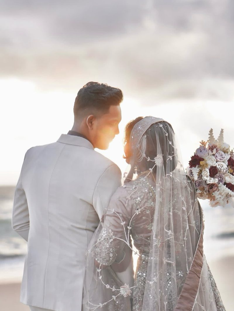 Couple at the beach during golden hour