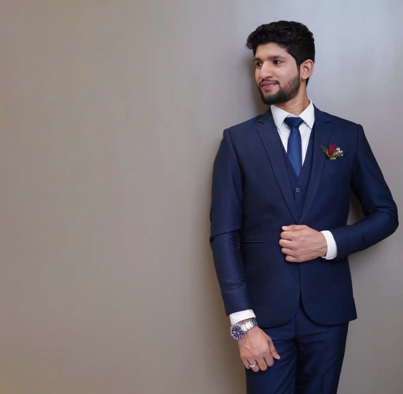 Solo groom portrait in tailored navy suit