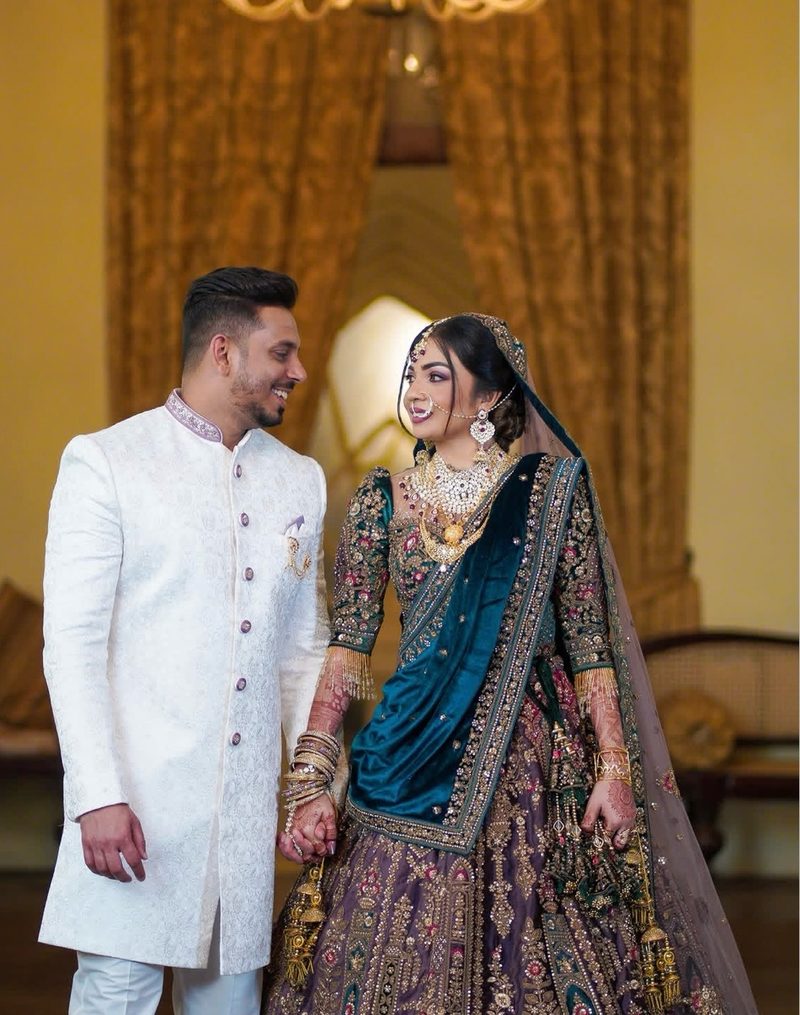 Traditional South Asian wedding couple in golden light
